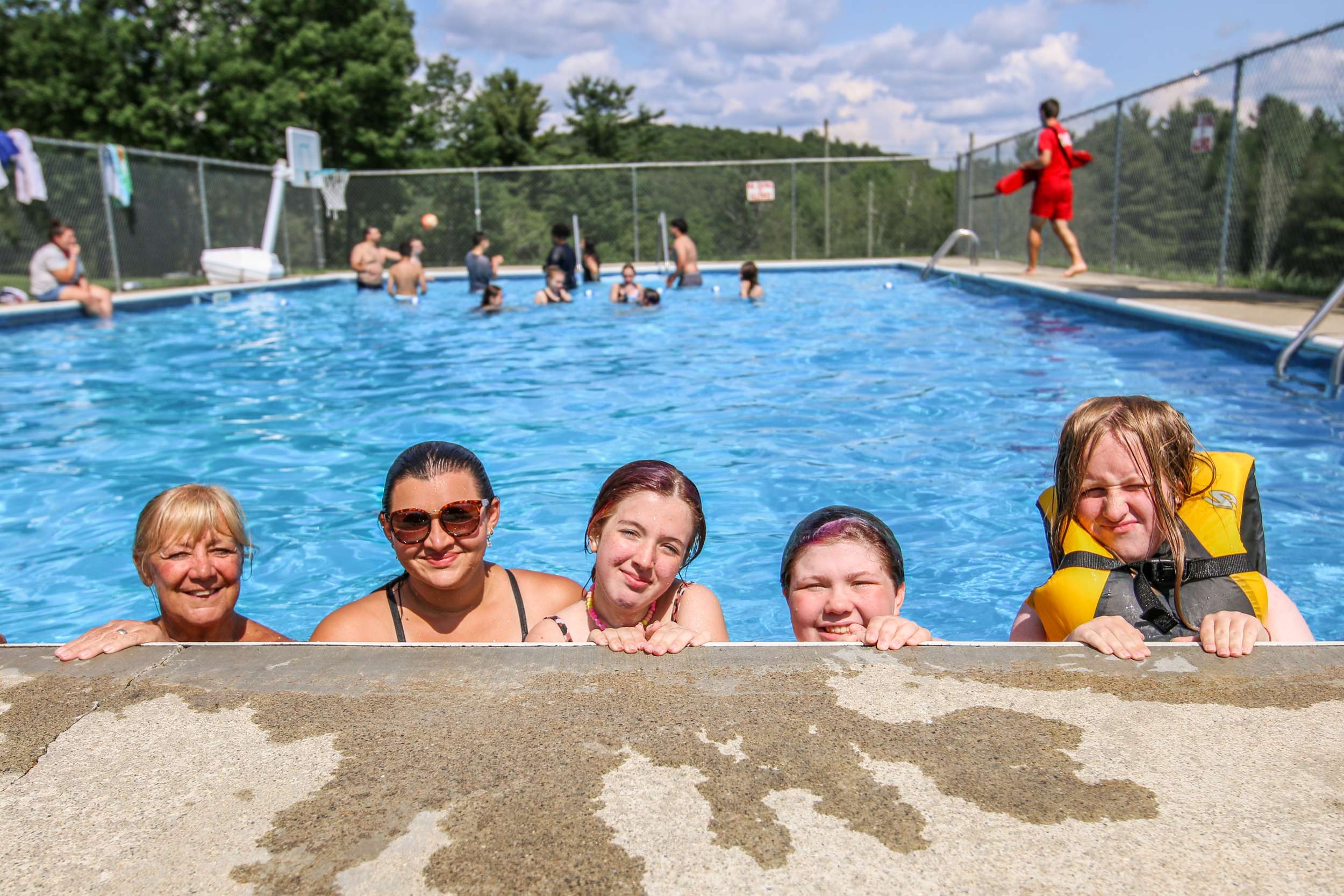 Young girls smiling in the swimming pool.