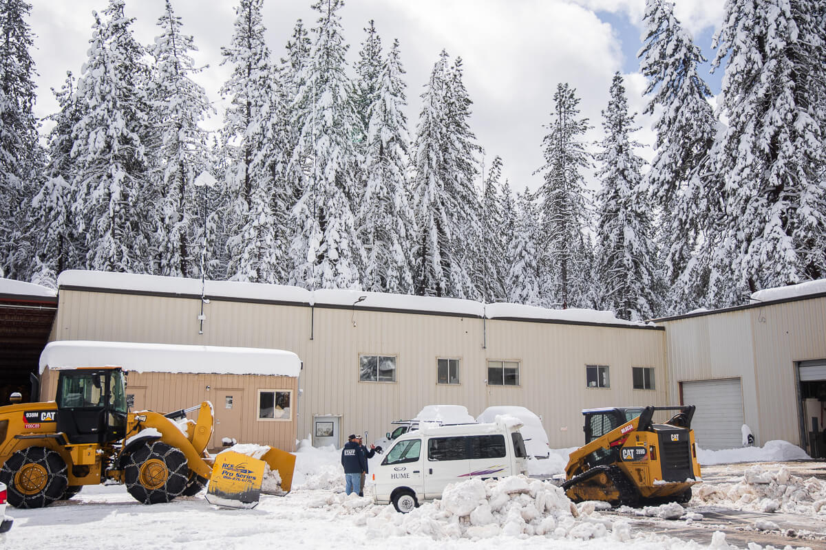 Snow, vehicles, and staff in the Operations Parking Lot.